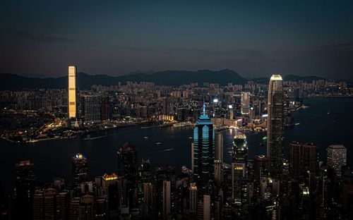 High angle view of city lit up at night