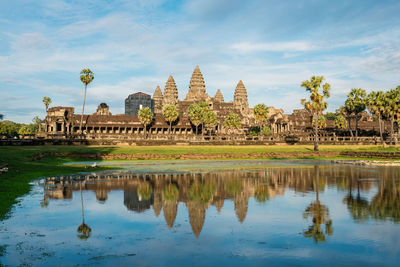 Angkor wat temple seen across the lake in siem reap at cambodia.