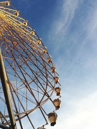 Low angle view of ferris wheel against sky