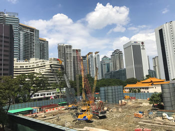 Modern buildings in city against sky