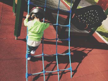 Full length of girl playing on playground