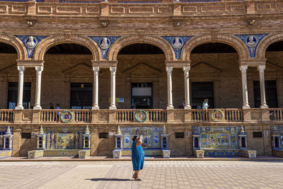 Man standing at historical building