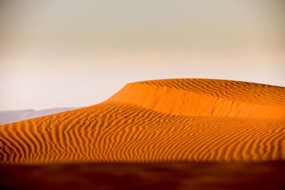 Scenic view of desert against clear sky