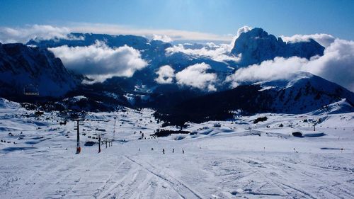 Scenic view of snow covered mountains against sky