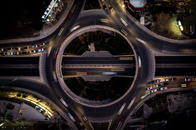 High angle view of city lit up at night