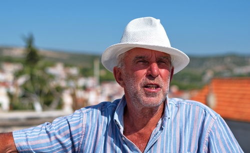 Portrait of man wearing hat