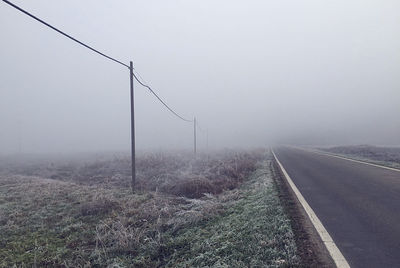Road against sky during foggy weather