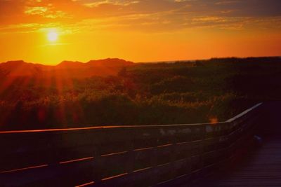 Scenic view of mountains at sunset