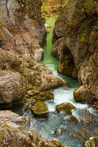 Rocks in river amidst rock formation