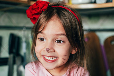 Close-up portrait of smiling girl