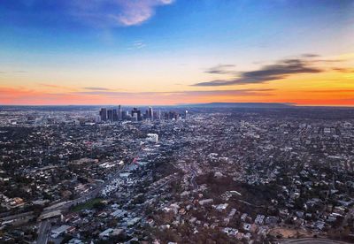 Aerial view of city at sunset