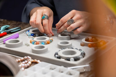 Cropped hand of man playing chess