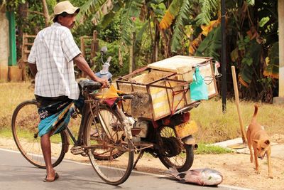 Man riding bicycle on road