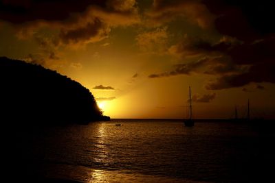 Scenic view of dramatic sky over sea during sunset