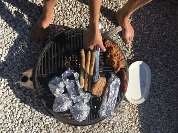 Low section of man preparing food