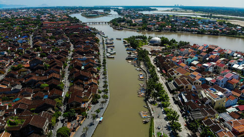 High angle view of river amidst buildings in city