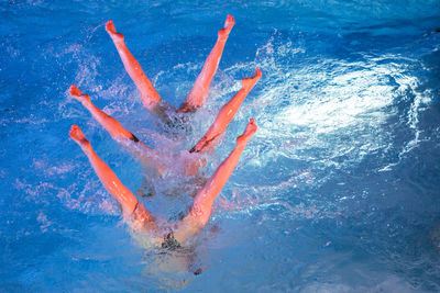 High angle view of girl swimming in pool