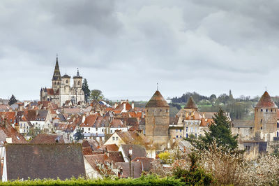 View of buildings in city against sky