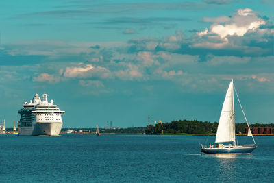 Sailboat in sea against sky