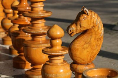 Close-up of chess pieces on sunny day