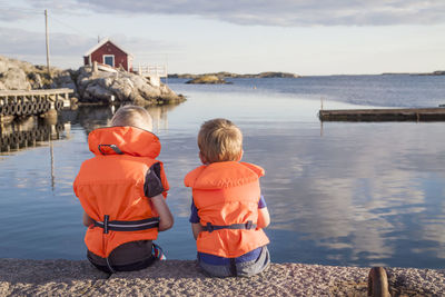 Boys sitting on jetty