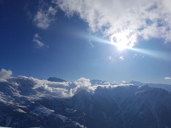 Scenic view of mountains against sky during winter