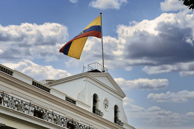 Low angle view of flag against sky