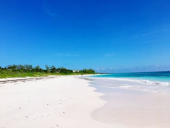 View of beach against blue sky