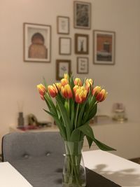 Close-up of flower vase on table at home