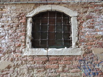 Close-up of window on brick wall