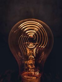 Close-up of illuminated light bulb