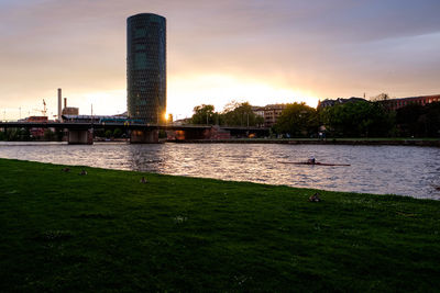 Scenic view of river against sky during sunset