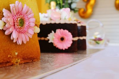 Close-up of pink daisy flower on table