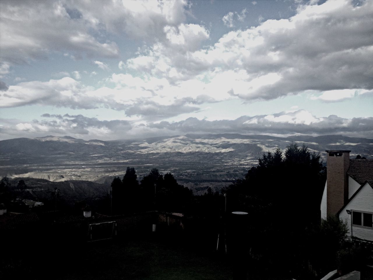 mountain, sky, building exterior, mountain range, built structure, architecture, cloud - sky, landscape, scenics, beauty in nature, tree, house, nature, silhouette, cloud, cloudy, tranquility, tranquil scene, residential structure, residential building