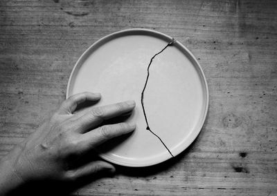 The hand that caresses the broken plate