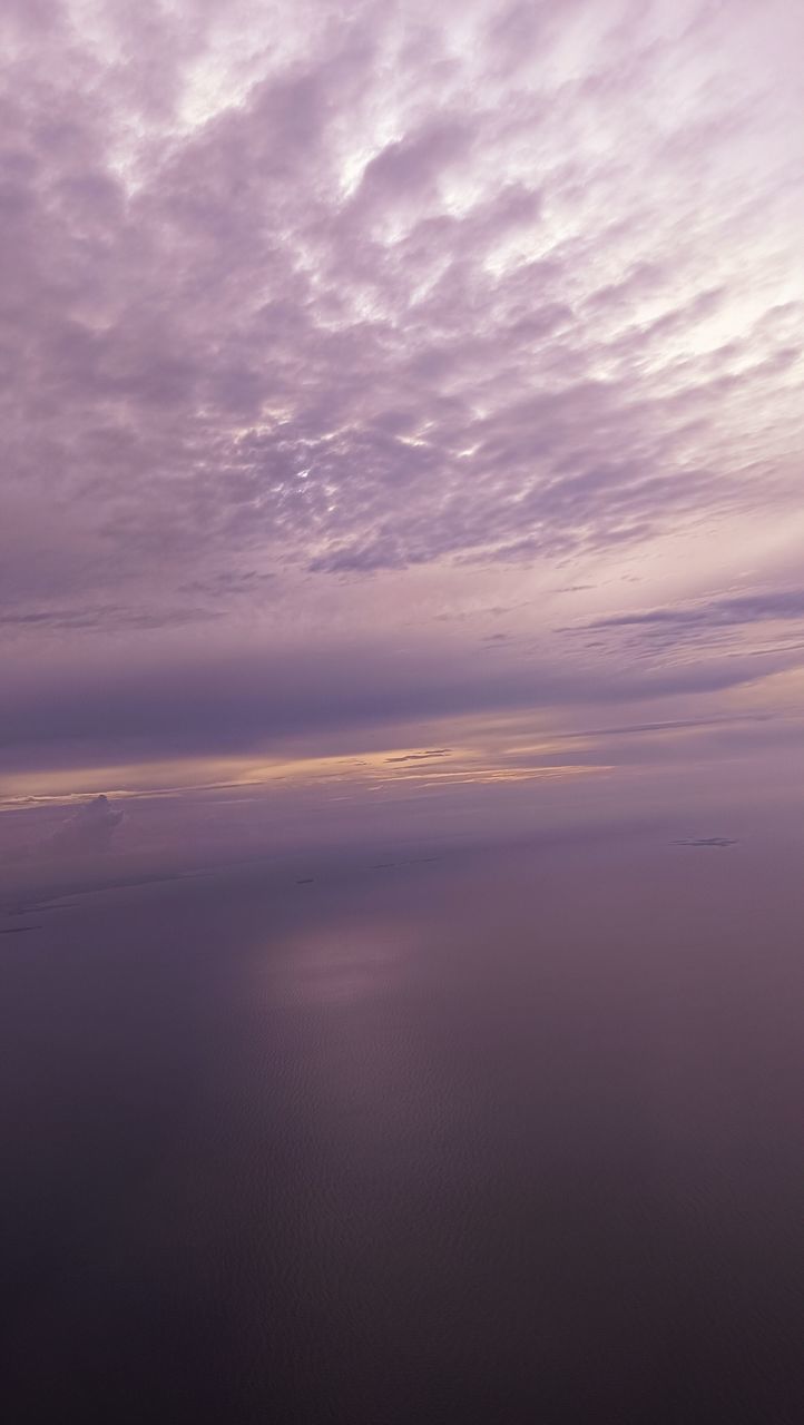 sky, cloud, horizon, beauty in nature, scenics - nature, tranquility, sunset, nature, tranquil scene, dawn, dramatic sky, cloudscape, water, no people, idyllic, sea, environment, sunlight, backgrounds, outdoors, awe, reflection, horizon over water, afterglow, atmospheric mood, ocean, pink, atmosphere, landscape, moody sky