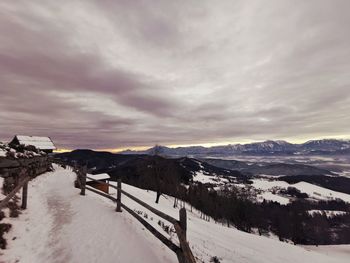 Scenic view of snow covered mountains against sky