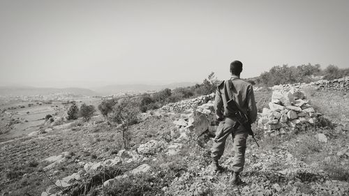 Rear view of a man on desert