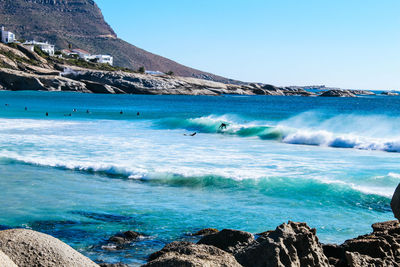 Scenic view of sea against clear blue sky