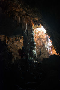 Low angle view of illuminated cave