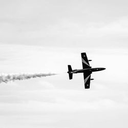 Low angle view of airplane flying in sky