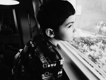 Close-up of boy using mobile phone