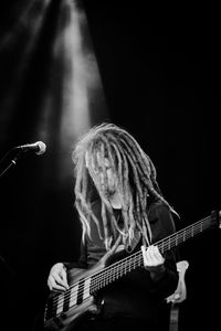 Performance of a bass player in black and white