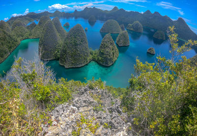 High angle view of rocks by sea