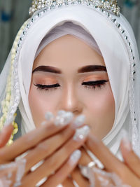 Close-up of young woman wearing hijab