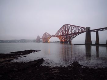 Bridge over sea against sky