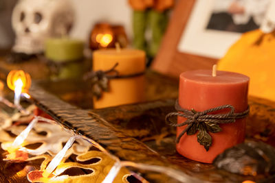 Close-up of tea light candles on table