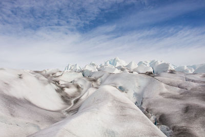 Scenic view of snow covered landscape against sky