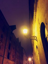 Low angle view of illuminated building at night