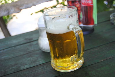 Close-up of beer glass on table